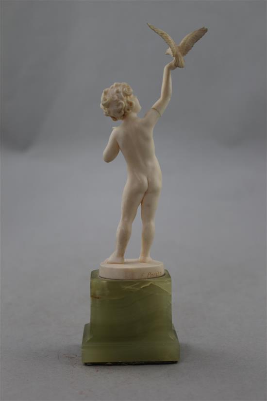 Ferdinand Preiss (German, 1882-1943). An Art Deco carved ivory figure of a young girl feeding a bird, 7.5in.